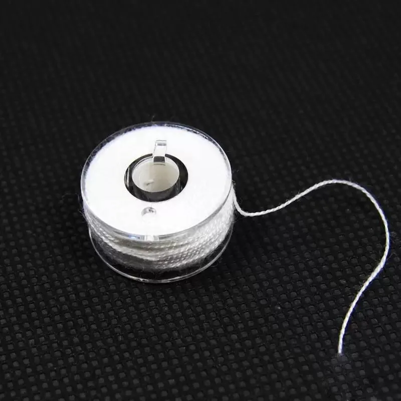 Spool of water-soluble PVA string for tying bait parcels
